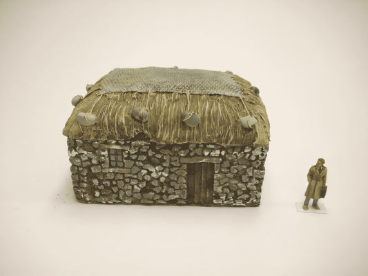 1:76  STONE CROFT WITH GRASS ROOF AND NET.